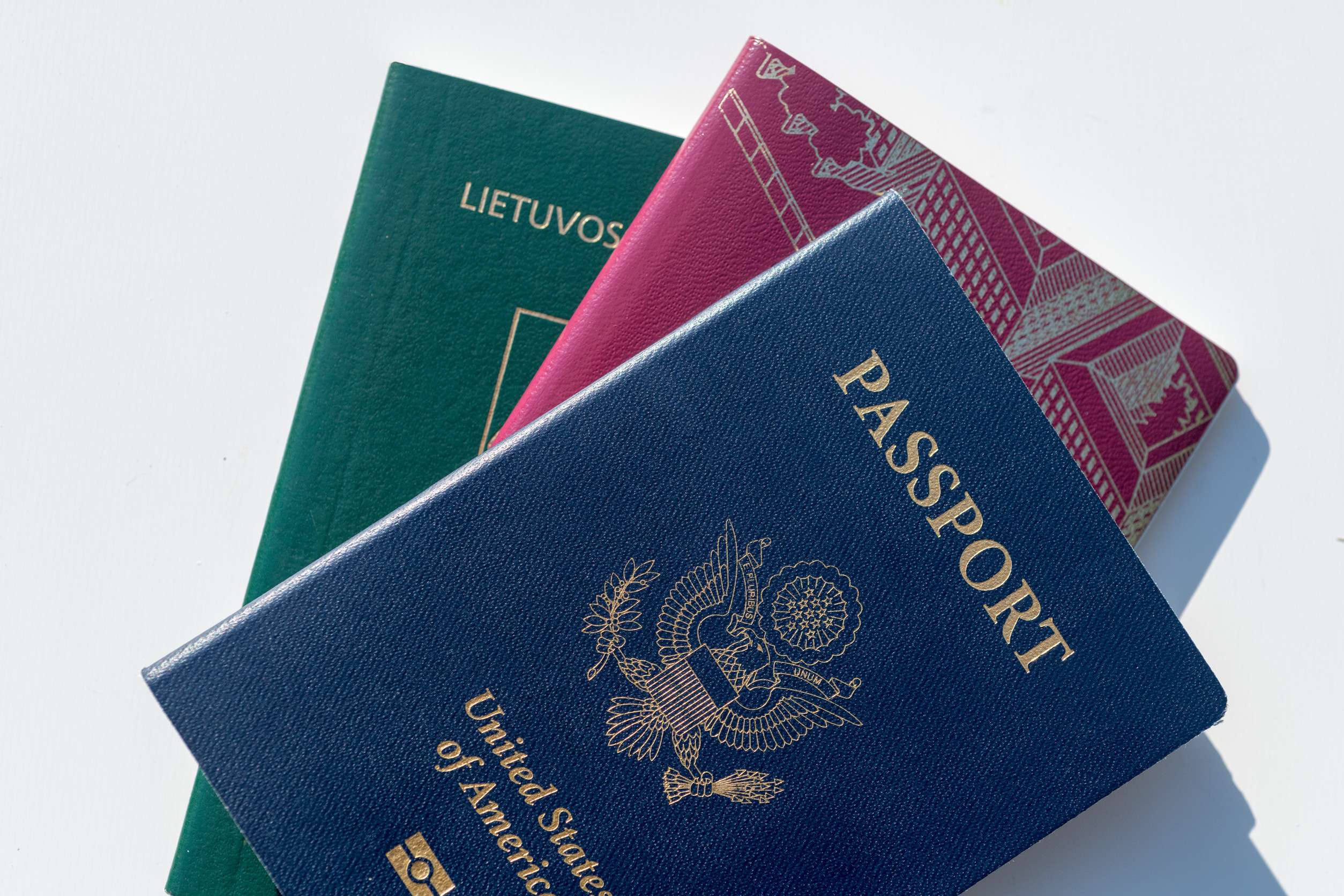 Dark Blue Us Passport Alongside Eu Style Red And Green Passports